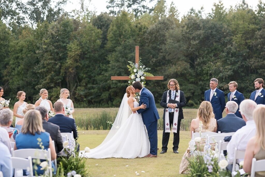 first kiss at wedding, the legacy at willow pond wedding, Raleigh wedding photographer, historic venues in Virginia, classic wedding venue, the legacy at willow pond wedding inspiration, Virginia wedding photos