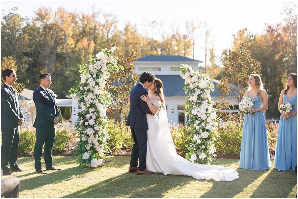 first kiss | outdoor ceremony | The Upchurch wedding inspiration | Classic fall wedding at The Upchurch | Elegant Raleigh wedding inspiration | The Upchurch wedding photos | Romantic wedding venue in Raleigh NC