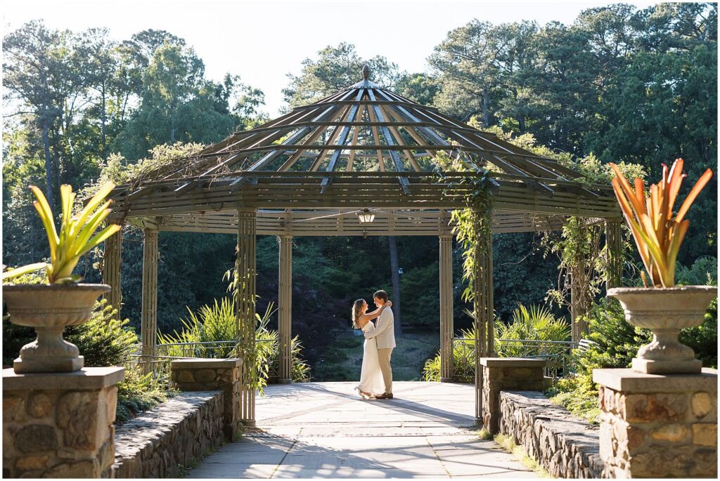 Dancing under the pergola together during engagement photos at Duke | Sarah Hinckley Photography
